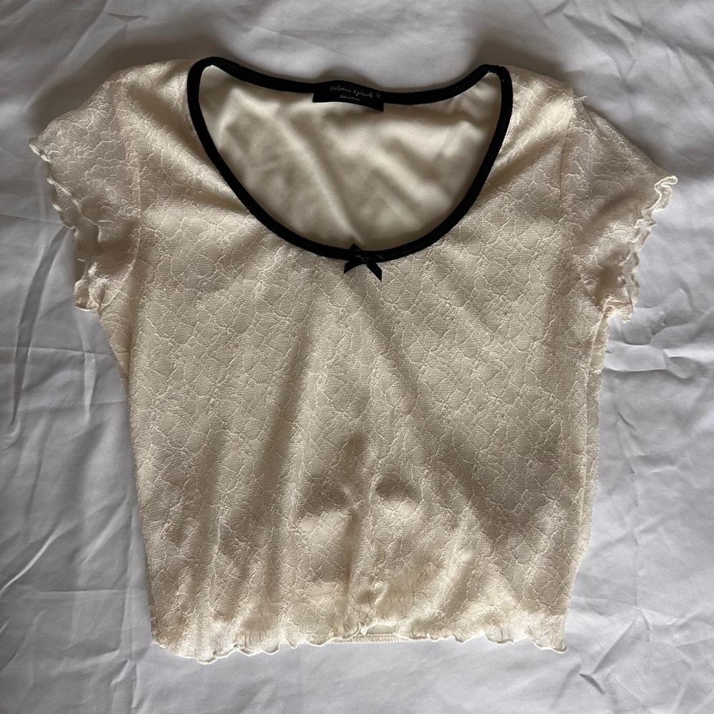 Elegant Cream Lace Top with Black Trim